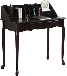 a desk with a clock, pen holder and other items on it's top