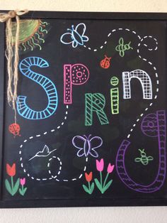 a chalk board with the words spring written on it