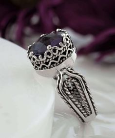 Looking for the perfect gift for your girlfriend, wife, mother, or sister? This gorgeous silver filigree art women's cocktail ring is the ideal choice. With its intricate details and beautiful face-up design, this ring is sure to stand out and make an impression. It features a double-sided, faceted checkerboard round-cut amethyst gemstone that measures 10mm and has a face size of 0.47 inches (12.00mm) in width. Not only is this ring stunning, but it also comes with a velvet pouch, silver polish Elegant Silver Crystal Ring With Birthstone, Elegant Silver Crystal Birthstone Ring, Elegant Silver Birthstone Ring With Stone Setting, Silver Filigree Open Ring, Elegant Adjustable Crystal Ring With Stone Setting, Ornate Silver Jewelry With Accent Stones, Stamped 925 Crystal Ring For Wedding, Silver Birthstone Ring With Center Stone, Elegant Formal Birthstone Ring With Stone Setting