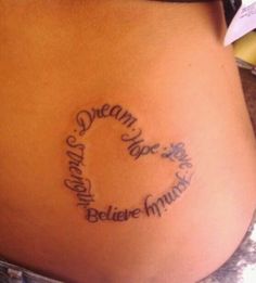 a woman's stomach with the words dream and believe written in cursive font