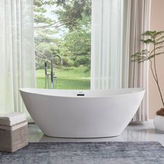 a large white bath tub sitting next to a window