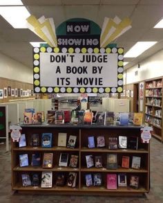 there is a sign that says show me don't judge a book by its movie