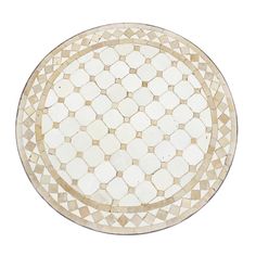 a white and gold plate with geometric designs on the surface, isolated against a white background