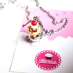 This necklace features a handmade ice cream sundae pendant. The pendant measures about  2.5 cm tall and is attached to a silver tone chain necklace that measures 24 inches in length. Cream Necklace, Handmade Ice Cream, Food Necklace, Decoden Phone Case, Miniature Food Jewelry, Food Charms, Food Accessories, Food Jewelry, Ice Cream Sundae