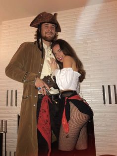 a man and woman dressed up as pirates