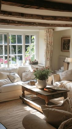 a living room filled with lots of white furniture