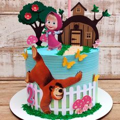 a birthday cake with an image of masha and the bear on it