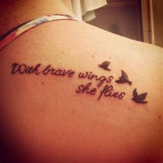 a woman with a tattoo on her back saying, well brave wings she flies and two birds