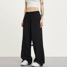 5ft 4''(166cm) tall, 95 lbs(43kg) weight and wearing a size S - BLACK- Wide baggy fit Black Stretch Pants For Streetwear, Black Hip Hop Parachute Pants With Relaxed Fit, Black Relaxed Fit Hip Hop Parachute Pants, Oversized Black Parachute Pants For Streetwear, Black Baggy Sweatpants For The Gym, Baggy Black Cargo Pants For Sports, Baggy Black Sweatpants For Gym, Oversized Wide Leg Black Parachute Pants, Oversized Black Sweatpants With Pockets