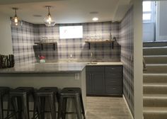 the kitchen is clean and ready to be used as a bar or dining room area