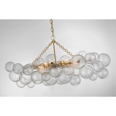 a chandelier with glass balls hanging from the ceiling