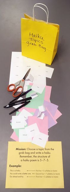 scissors and paper on top of a table next to a yellow shopping bag with writing