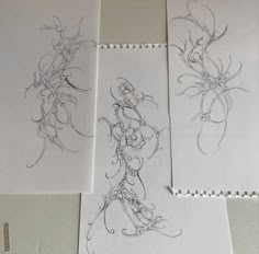 three drawings are shown on the wall next to each other, and one is drawn in pencil