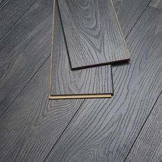 two pieces of wood are laying on the floor