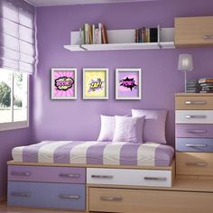 a bedroom with purple walls and white bedding, drawers, and bookshelves