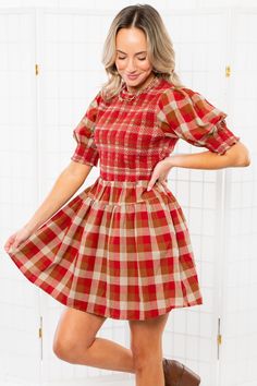 Get ready to sleigh the this season in style with the Smocked Plaid Red Mini Dress.  This fit and flare dress features a charming smocked bodice, fashion-forward puff sleeves, and a chic mini length that will make you stand out at any festive gathering. Whether paired with boots for a laid-back vibe or dressed up with heels for a touch of glamour, this dress is perfect for capturing picture-perfect moments during the holiday season.   Features:   Flattering fit and flare style for a feminine sil Plaid Dresses, Holiday Plaid, Fall Wedding Guest Dress, Baseball Outfit, Fit And Flare Silhouette, Graphic Tee Dress, Gameday Outfit, Maxi Dresses Casual, Midi Maxi Dress