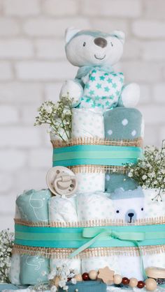 Elevate your baby shower with personalized charm! Explore creative DIY Diaper Cake ideas that will make a memorable centerpiece for the special occasion. Diaper Cake Castle, Diaper Cake Ideas, Baby Shower Gift Idea, Small Stuffed Animals