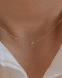 Discover the charm of the coquette era with our 14k Gold Dainty Bow Necklace. The small, delicate bow is ideal for everyday wear, making it a must-have accessory. • 14k Yellow Gold• Bow measures about 6mm Dainty Prom Jewelry, Simple Necklace Aesthetic, Gold Bow Jewelry, Classic 14k Gold Charm Necklaces, Dainty 14k Gold Charm Necklace For Formal Occasions, Elegant Tiny Charm Necklaces In 14k Gold Filled, Elegant 14k Gold Jewelry With Bow Detail, Elegant 14k Gold Jewelry With Bow, Gold Bow Necklace