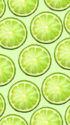 lime slices are arranged on a green background