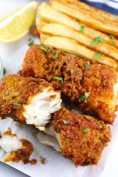 crispy fish fingers are served with lemon wedges