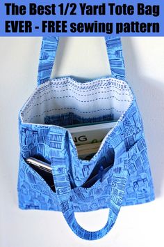 a blue purse hanging on the wall with a cell phone in it's pocket