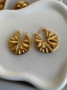 ✨Elevate your elegance with our Brooklyn Gold Earrings, a quintessential blend of allure and sophistication. ✨Crafted from lustrous 18K gold, these earrings embody timeless charm and modern refinement. ✨Their sleek, sculptural design captures light with every movement, creating a captivating sparkle that effortlessly enhances any ensemble. ✨Perfectly suited for both intimate gatherings and grand soirées, the Brooklyn Gold Earrings are a statement of luxury and a testament to your impeccable taste. ✨Indulge in a touch of opulence and let these exquisite pieces become the cornerstone of your jewelry collection. Ring Necklace, Ring Sets, Necklaces Bracelets, Gold Earrings, Brooklyn, Jewelry Collection, 18k Gold, Sleek, Sparkle