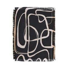 a black and white scarf with an abstract design