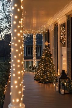 a porch covered in christmas lights and trees