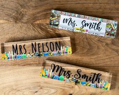 two personalized wooden pencils are sitting on a wood table with the name mr and mrs smith