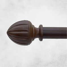 a close up view of a wooden door handle on a white background with copy space