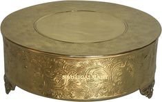 an ornately decorated gold metal box with lid