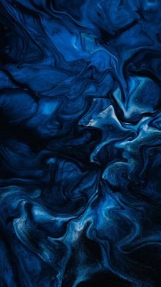 an abstract painting in blue and black with white swirls on the bottom right side