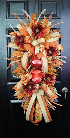 a fall wreath on the front door