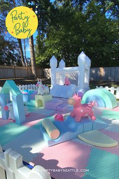 an inflatable birthday party set up with balloons and decorations for a baby's first birthday