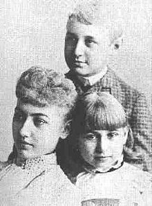 an old black and white photo of three people