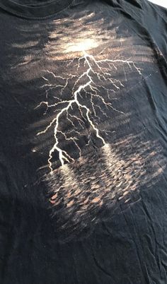 a t - shirt with a lightning design on it