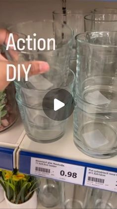 a shelf with clear glass vases on it and the words action diy written above them