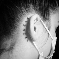 a woman's ear with the word love written in cursive writing on it