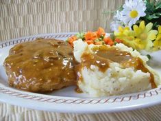 a white plate topped with food and flowers