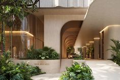 the entrance to an office building with lots of greenery and plants on either side