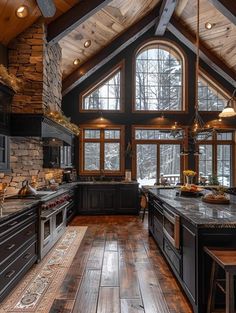 a large kitchen with wood floors and vaulted ceiling