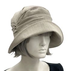 Fitted Beige Cloche Hat, Classic Linen Hat With Curved Brim, Linen Fedora Hat For Spring, Classic Adjustable Linen Hat, Linen Hat With Short Brim, Fitted Beige Brimmed Cloche Hat, Adjustable Linen Hat With Curved Brim, Linen Short Brim Hat, Linen Bucket Hat For Spring