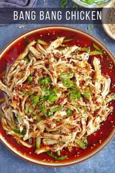 a plate filled with chicken and vegetables on top of a table