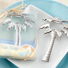 a bottle opener with a palm tree on it sitting next to a packaged bar of soap