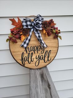 a wooden sign that says happy fall y'all