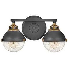 two light bathroom fixture with black and gold fixtures