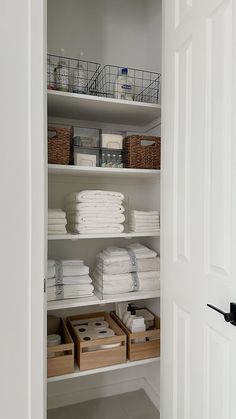 the closet is full of folded towels and other things to use as storage for linens