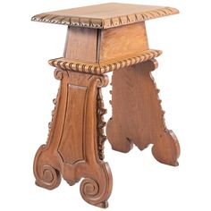 an old wooden stool with carvings on the legs and seat is isolated against a white background