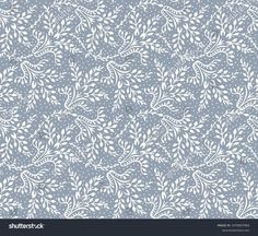 a blue and white wallpaper with leaves