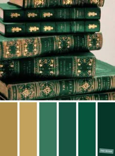 green books are stacked on top of each other, with gold trimmings in the middle